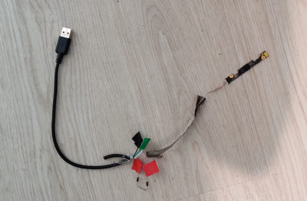 Picture of a webcam soldered to a USB cable